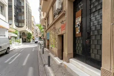 a street with a building with graffiti on it at Neo Luxury Suite in Athens