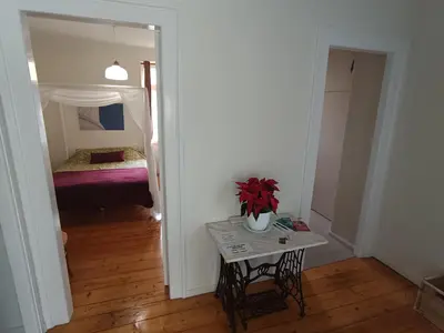 a room with a table and a bed and a mirror at AcroView in Athens