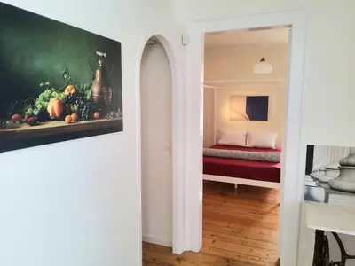 a room with a painting of fruit and a bed at AcroView in Athens