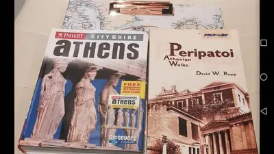 two magazines sitting on top of a wall at Asklipiou New Smart Mondern Central Studio in Athens