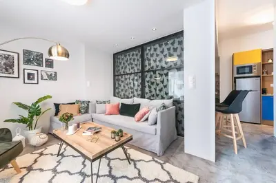 a living room with a couch and a table at The Boutique in Athens