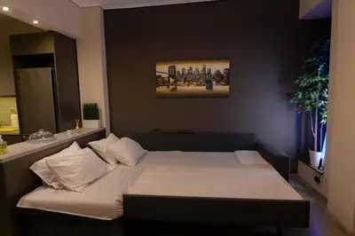 a bedroom with a bed in a room at Luxury apartment 10’ from the center! in Athens
