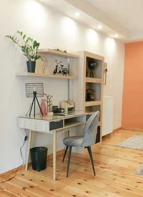 a desk with a chair in a room at Unique, Stylish Studio near Beaches in Athens