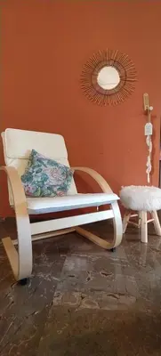 a white chair in a room with a mirror at Experience the sweetest nest at Marina Zea in Piraeus