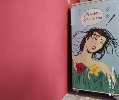a poster of a woman with flowers on a wall at Experience the sweetest nest at Marina Zea in Piraeus