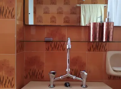 a bathroom with a toilet and a sink at Experience the sweetest nest at Marina Zea in Piraeus