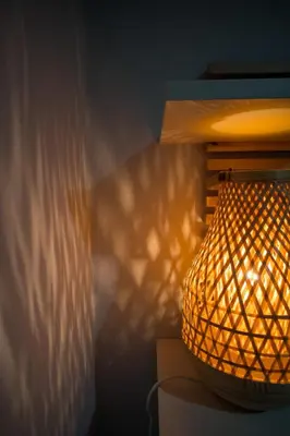 a lamp that is sitting next to a wall at It is a pleasant, modern, functional house! in Piraeus