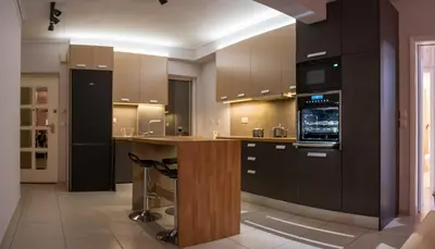 a large kitchen with a island in the middle at It is a pleasant, modern, functional house! in Piraeus
