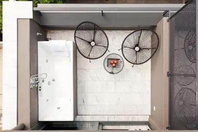 a pair of bicycle wheels on the side of a wall at Trendy Hotel by Athens Prime Hotels in Athens