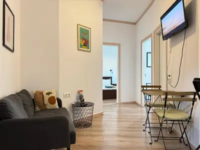 a living room with a couch and a table at B&B Boutique Two Bedrooms Apartments in Athens