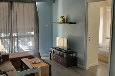 a living room with a couch and a table at Modern Cozy Apartment in Downtown Athens in Athens