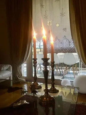 a table with two candles on top of it at The Magnolia - Sophisticated residence in Athens