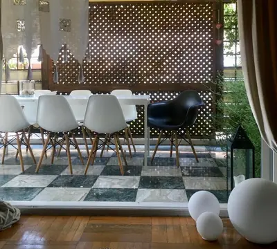 a dining room with a table and chairs at The Magnolia - Sophisticated residence in Athens