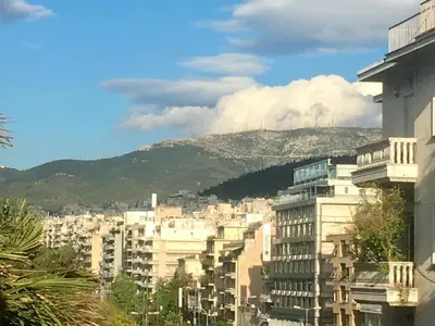 a view of a city with buildings and a mountain at The Magnolia - Sophisticated residence in Athens