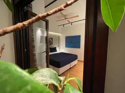 a bedroom with a bed and a mirror at Acropolis Lux Apartment in Athens