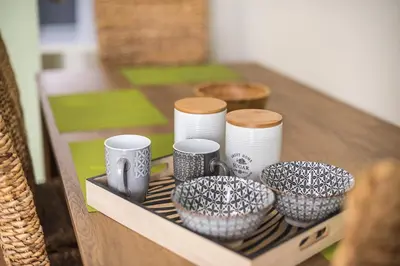 a tray with bowls and cups on a table at Boutique Suite by CloudKeys in Athens