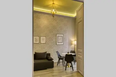 a living room with a couch and a table at Plaka Filotheis House B in Athens
