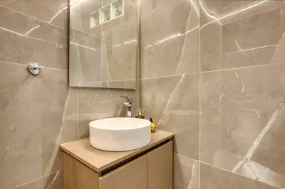 a bathroom with a sink and a mirror at Plaka Filotheis House B in Athens