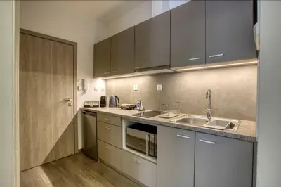 a kitchen with a sink and a counter top at Plaka Filotheis House B in Athens