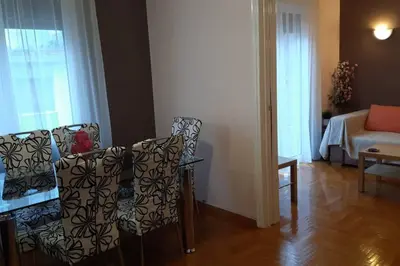 a living room with two chairs and a couch at Georgia's Cozy Apartment in Koukaki in Athens