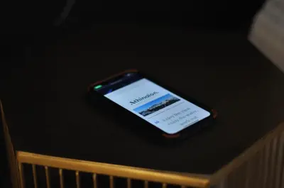 a cell phone sitting on top of a table at Athinaion Recreation Suites in Athens