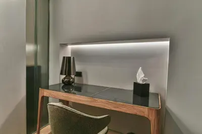 a desk with a lamp and a tissue box on it at Athens Dom Hotel in Athens