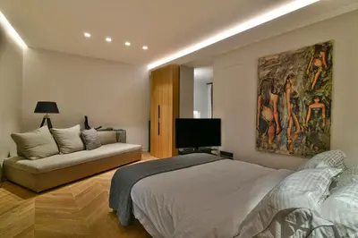a bedroom with a bed and a couch at Athens Dom Hotel in Athens