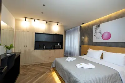a hotel room with a bed with towels on it at Triple A - Between 3 Squares - Monastiraki & Syntagma & Psiry - FREE Parking! in Athens