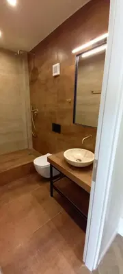 a bathroom with a sink and a toilet and a mirror at Triple A - Between 3 Squares - Monastiraki & Syntagma & Psiry - FREE Parking! in Athens