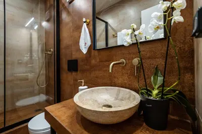 a bathroom with a bowl sink and a shower at Triple A - Between 3 Squares - Monastiraki & Syntagma & Psiry - FREE Parking! in Athens