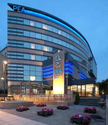 a large building with a sign in front of it at Spacious apartment close to the sea and the city center in Athens