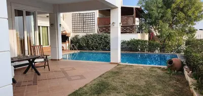 a house with a swimming pool in a yard at Athenian Luxury Villa in Glyfada in Athens