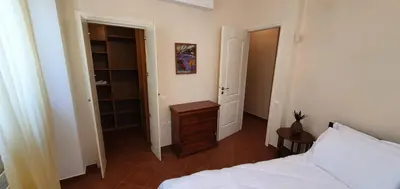 a bedroom with a bed and a walk in closet at Athenian Luxury Villa in Glyfada in Athens