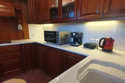 a kitchen with a counter top with a microwave and appliances at Athenian Luxury Villa in Glyfada in Athens