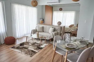 a living room with a couch and a table at The EL GRECO spirit meets the Athenian luxury Apt1 in Athens