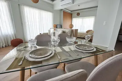 a dining room with a glass table and chairs at The EL GRECO spirit meets the Athenian luxury Apt1 in Athens