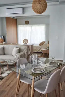 a living room with a glass table and chairs at The EL GRECO spirit meets the Athenian luxury Apt1 in Athens