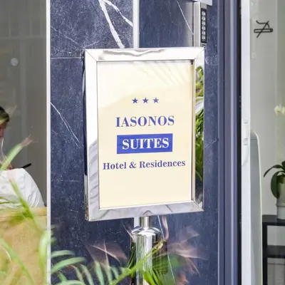 a sign in a window of a hotel andresos suites at Iasonos Suites Athens in Athens
