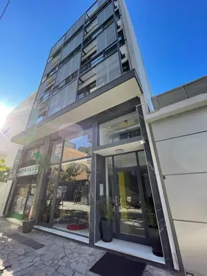 an office building with glass doors in front of it at Iasonos Suites Athens in Athens