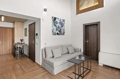 a living room with a couch and a table at ATHENIAN VIEW LOFT in Athens