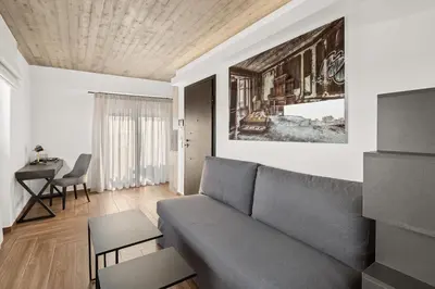 a living room with a couch and a table at ATHENIAN VIEW LOFT in Athens