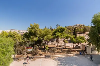 a group of people walking around a park at Katsanis luxury apt., stunning view of acropolis in Athens