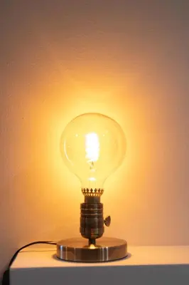 a light bulb sitting on top of a table at The brand new House meets the ideal location Apt1 in Athens