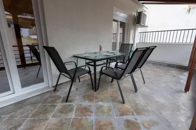 a glass table and chairs on a balcony at Athenian Port Luxury Apartment 1/Piraeus Riviera in Piraeus