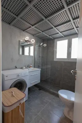 a bathroom with a shower and a sink and a toilet at Athenian Port Luxury Apartment 1/Piraeus Riviera in Piraeus