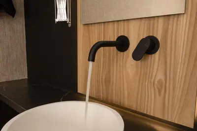 a toilet with water coming out of a faucet at The Fountain Athens in Athens