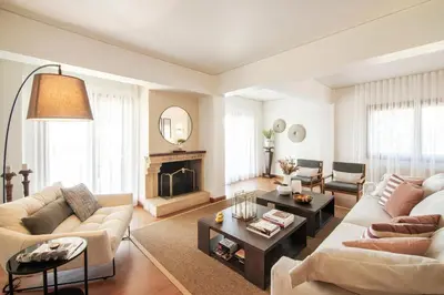 a living room with two couches and a fireplace at Villa Terra Mare in Vari