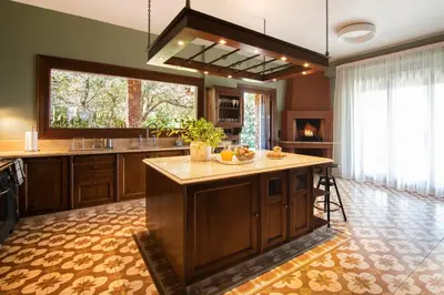 a large kitchen with a large island in the middle at Villa Terra Mare in Vari