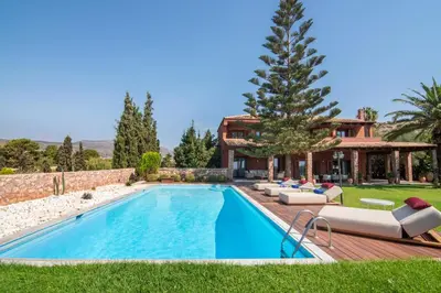 a swimming pool in the backyard of a house at Villa Terra Mare in Vari