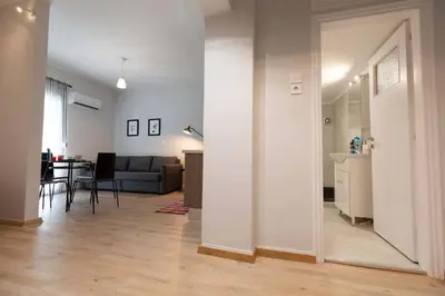 a living room with a couch and a table at The brand new House meets the ideal location Apt2 in Athens